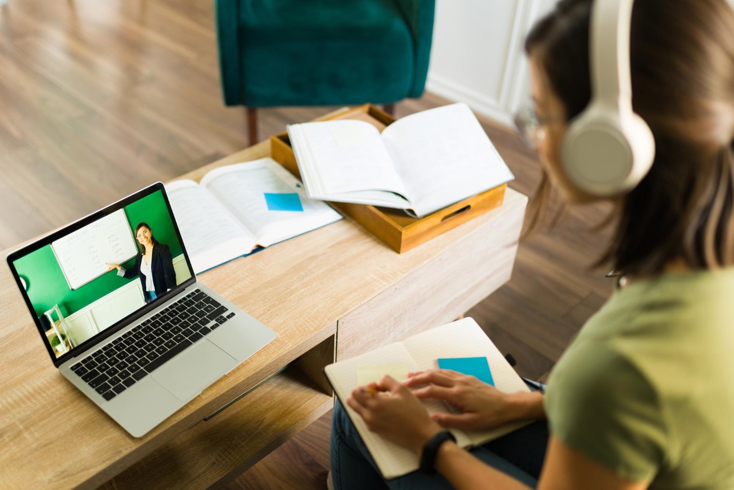 Female student watching to webinar on laptop